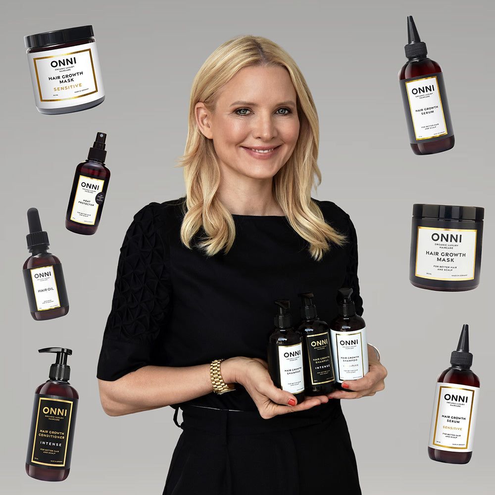 Frau umgeben von den ONNI Haarpflege Produkten